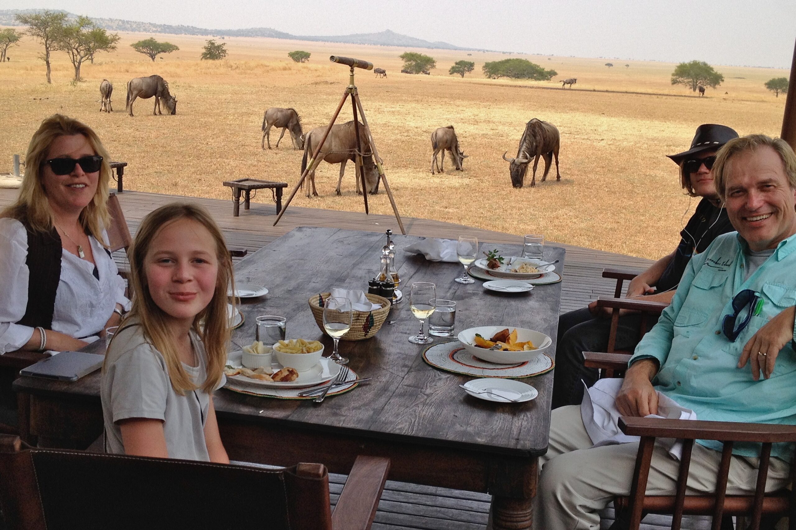 Families enjoying a private dining experience on safari at Singita.